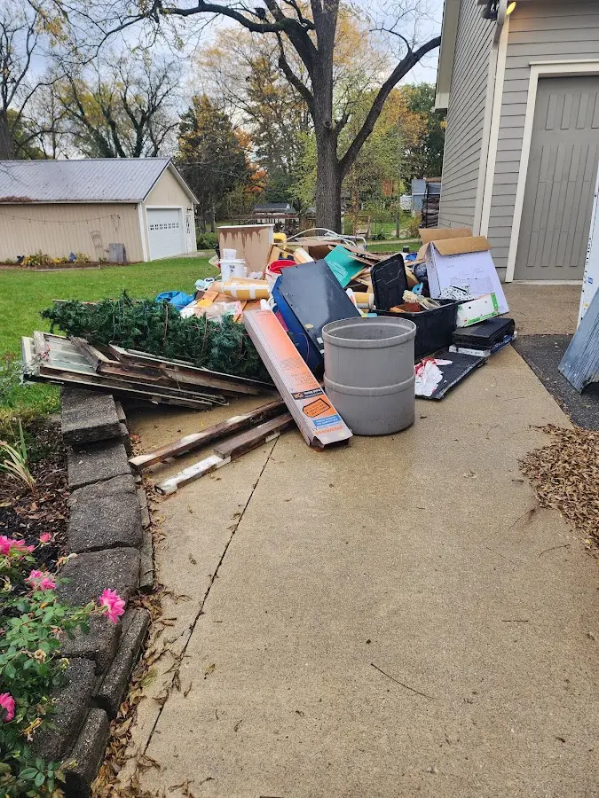 Dumpster being loaded with debris for Residential Dumpster Rental in White City